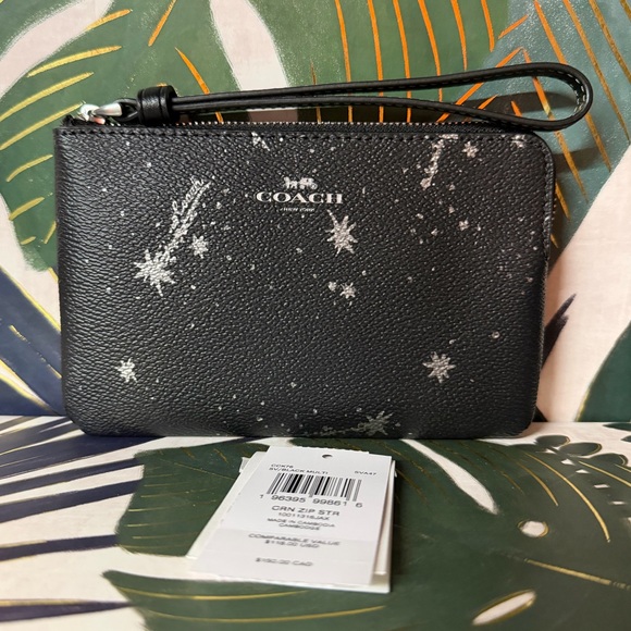 Coach Handbags - Coach Star Black and Silver Wristlet NWT